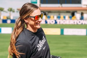woman in sunglasses on baseball field