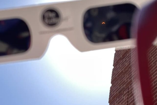 The view of the solar eclipse through glasses