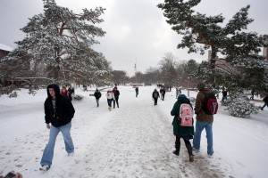 Students walk on snowy Quad
