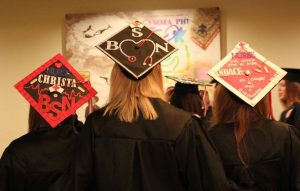 Mennonite College of Nursing graduates mortarboards