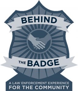 image of a badge with hands shaking.