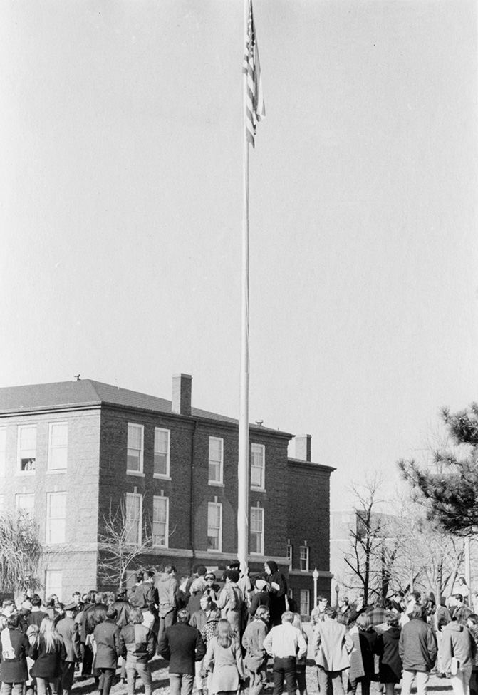 Members of the Black Student Association gather around the flagpole on December 4, 1969