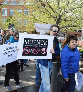 Illinois State Professor Steven Juliano holds a sign at the March for Science in Normal (Photo by Wolfgang Stein)