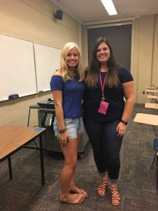 Two female students standing next to each other