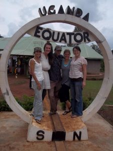 Doug Gass with friends at the equator in Uganda. 