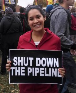 Montesdeoca with a "Shut Down the Pipeline" sign 