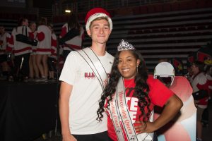 boy in crown and woman in tiara smiling