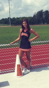 Tristen Sharp as a high school cheerleader