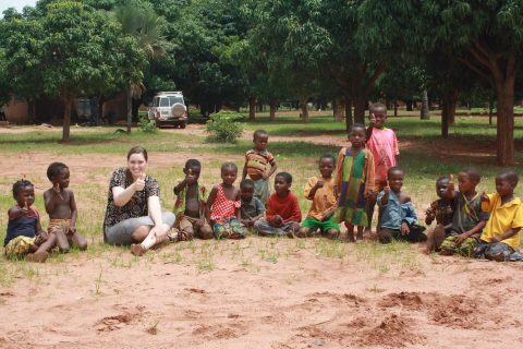Abby Mustread, ISU Bone Scholar, with group of children.