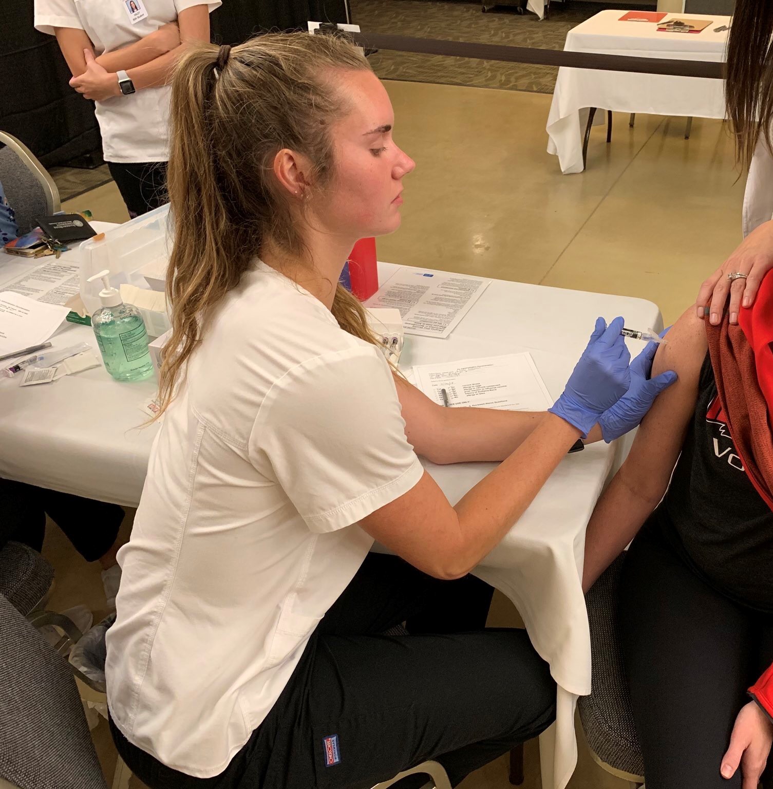 Ali Line, Mennonite College of Nursing student, working the flu clinic on campus.