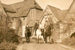 Members of the Ewing family out for a ride on horses at Ewing Manor