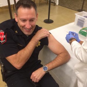 University Police Chief gets his flu shot at the Faculty Staff flu clinic. 