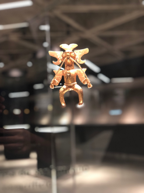 A gold figure on display.