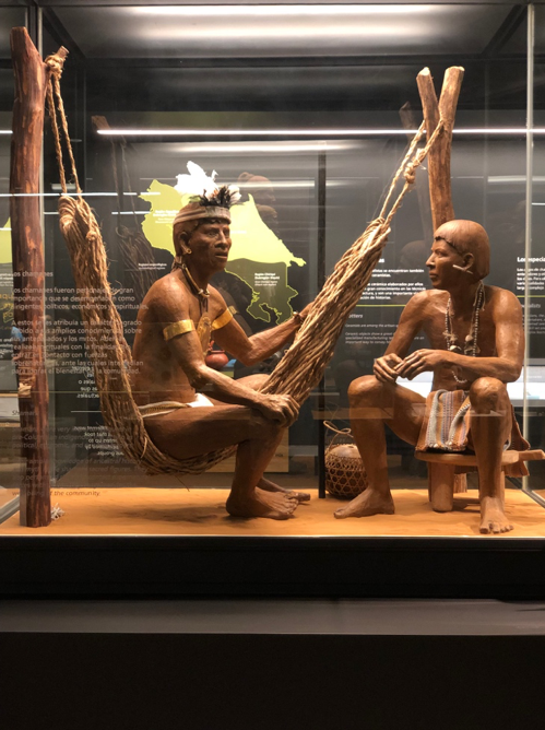 A display of a healer speaking with a patient.
