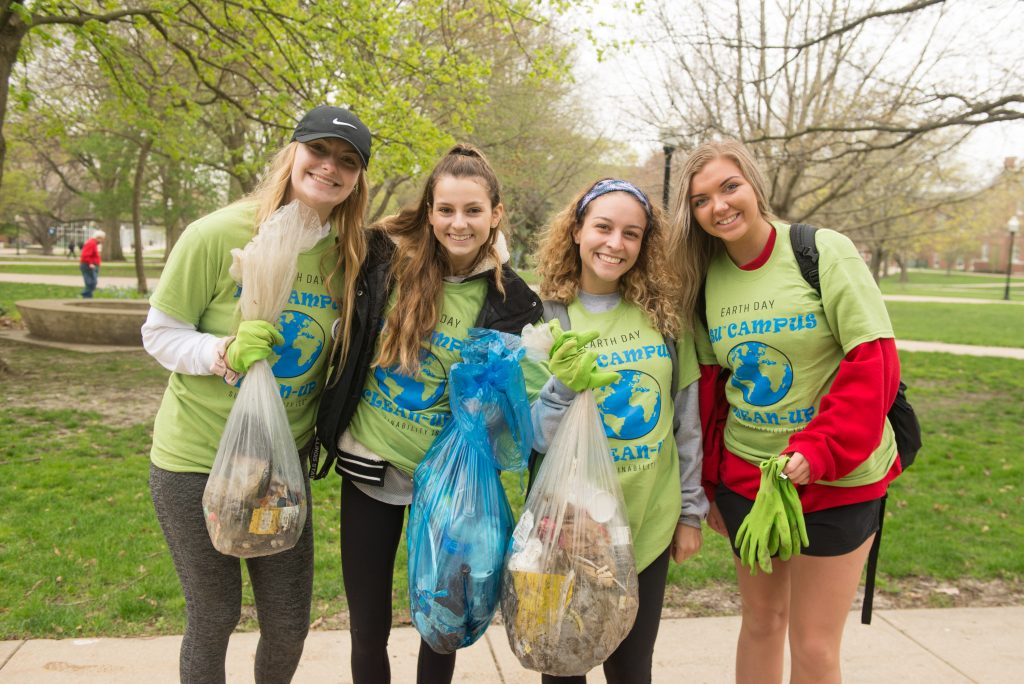 Students show off the waste they've collected for Campus Cleanup Day.