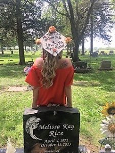 Elizabeth Rice lost her mother her freshman year. She visited her grave after earning her bachelor’s degree in 2017 from Illinois State University.