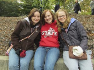 three ISU students enjoying the homecoming parade