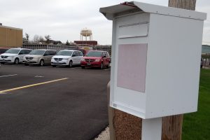 White metal drop box for fleet vehicle keys beside the F93 parking lot