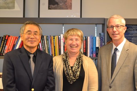 group photo of the department chair, a professor and a guest speaker