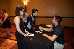 Schulyer Bailar spoke with and signed autographs for attendees following his speech at the LGBTQA Cultural Dinner.