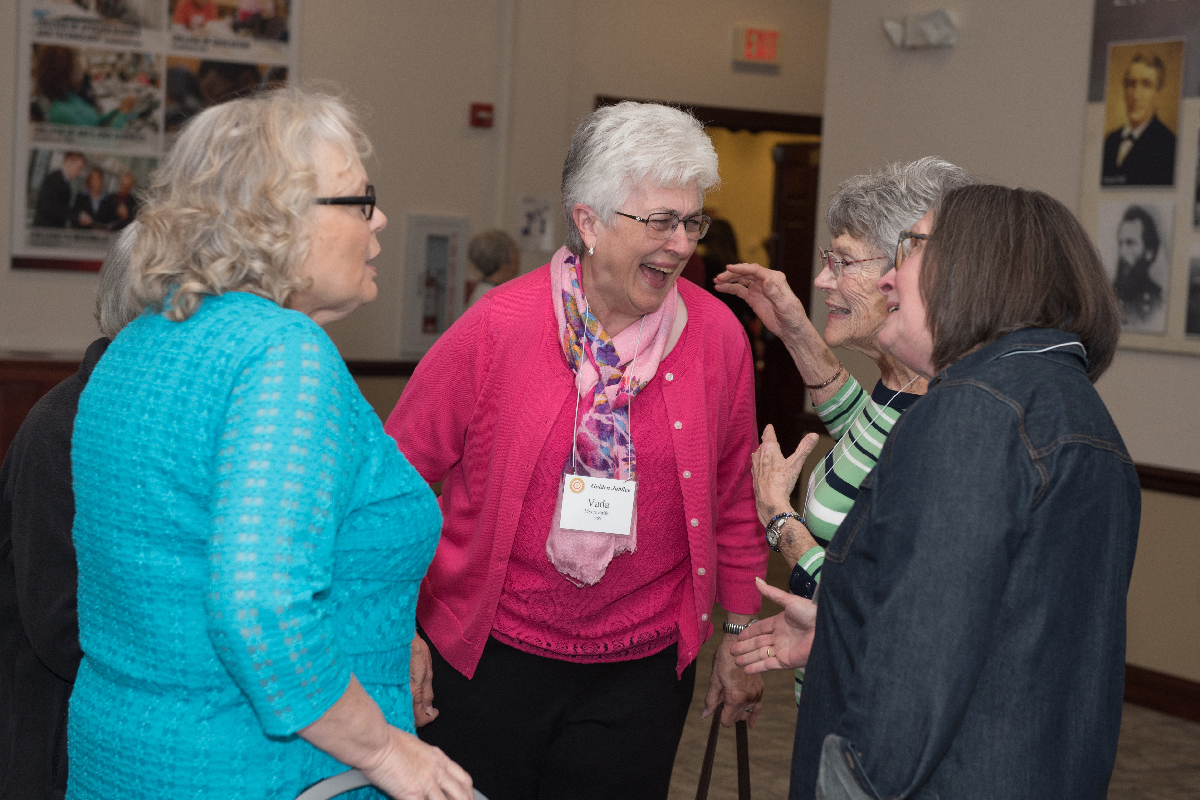 Vada Saffer '69 shares a laugh with fellow MCN alumni.