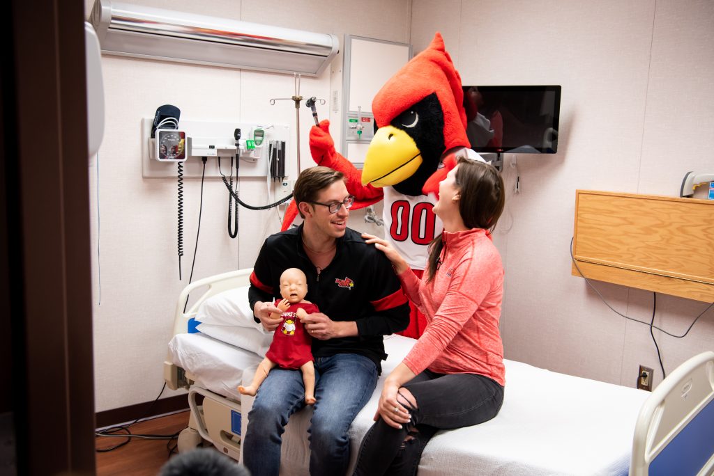 Reggie Redbird and Keith and Becky Habersberger