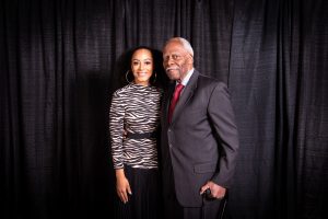 Angela Rye standing next to Andrew Purnell