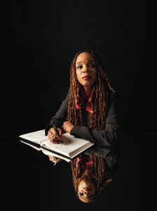 Woman writing in book