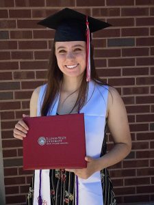 Illinois State biology teacher education graduate Megan Tunney ’20 holding diploma