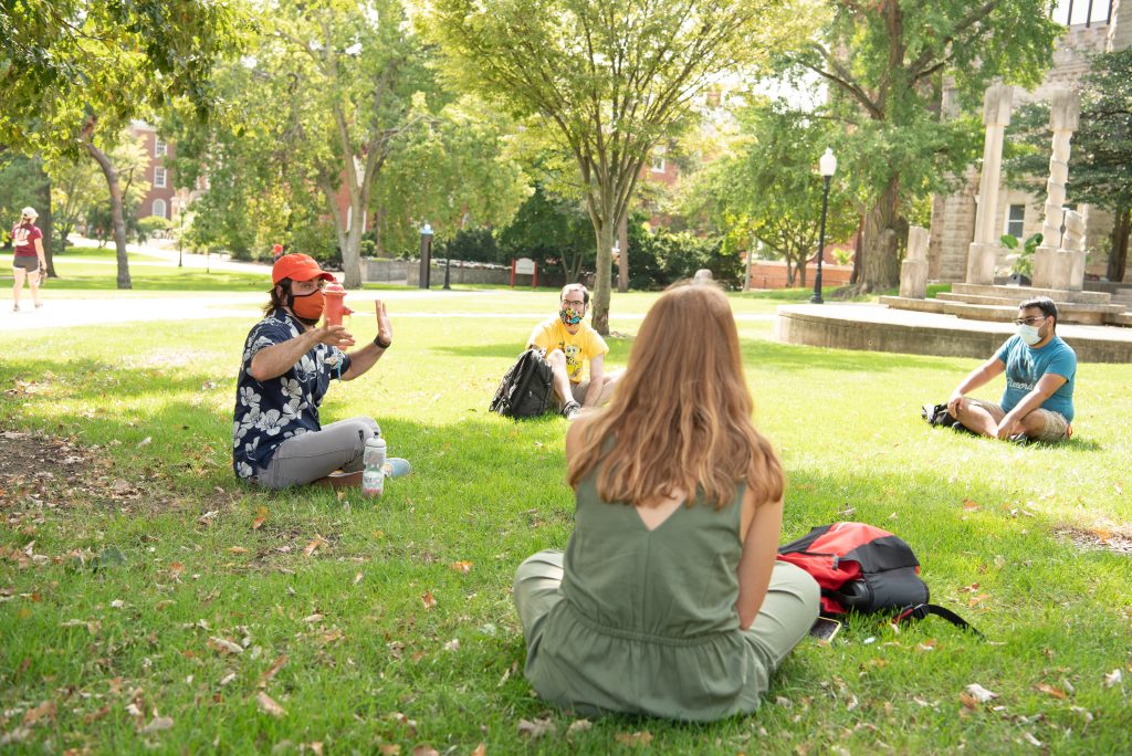 Professor leads class in an outdoor setting