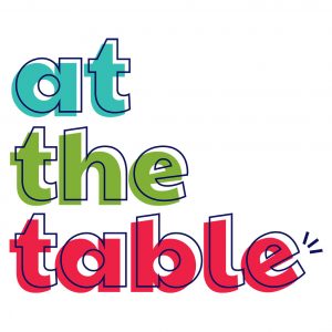Logo that reads at the table