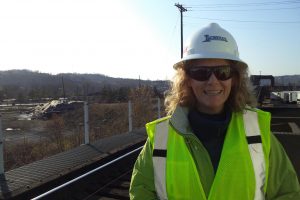 Woman in hard hat and highlight vest